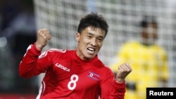 South Africa -- North Korea's Ji Yun-nam celebrates his goal during a 2010 World Cup Group G soccer match at Ellis Park stadium in Johannesburg,15Jun2010