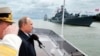 RUSSIA -- Russian President Vladimir Putin, second left, reviews a Navy parade during celebrations for Russian Navy Day, in Baltiisk, in the Kaliningrad region, during celebrations for Russian Navy Day, July 26, 2015