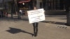 Kazakhstan - Aruzhan Duysebayeva, one of the supporters of "Democratic party" is holding a banner at Arbat. Almaty, 6 November 2020